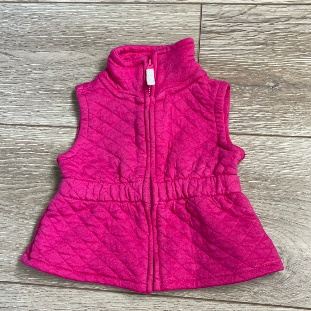 Carter’s pink quilted zip-up vest. 6 months